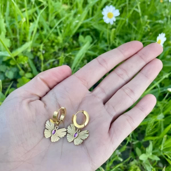 Pink Mariposa mini hoop earrings.